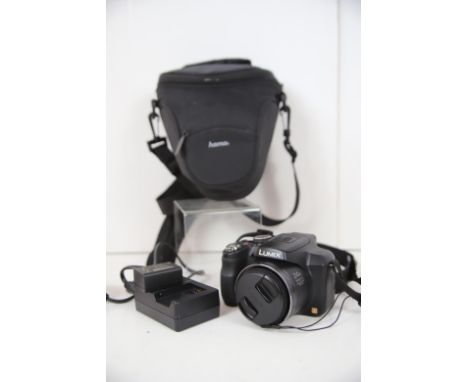 Panasonic Digital Camera model number DMC-FZ62. Lumix model with 24x Zoom. Comes with battery, Charger and case.  See photos