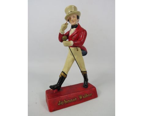 A Johnnie Walker vintage advertising bar figurine, 8" tall.