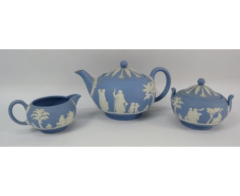 Wedgwood blue jasperware teapot, sugar bowl and milk jug.