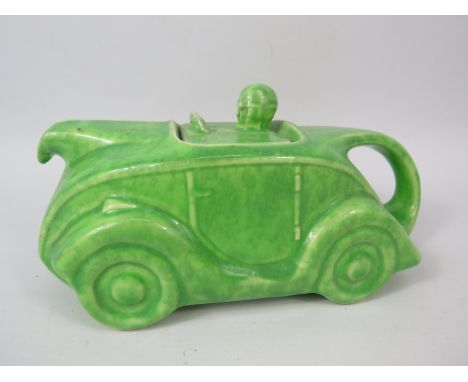Vintage Sadler racing car teapot in green glaze, 9" long.