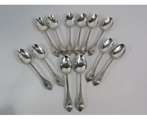 Set of 12 Walker and Hall sterling silver tea spoons, 299 grams.