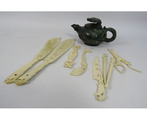 A Chinese Jade stone carved teapot plus a selection of bone carved items, letter openers, scissors etc.