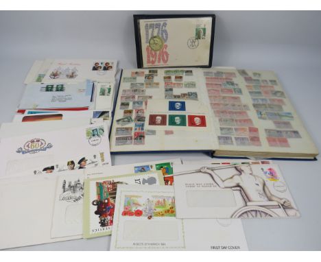Stamp album part filled with world stamps and a selection of first day covers.
