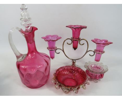 Mixed Cranberry glass lot to include three branch epergne, small decorative dish in perfect condtion. Other items have glued 