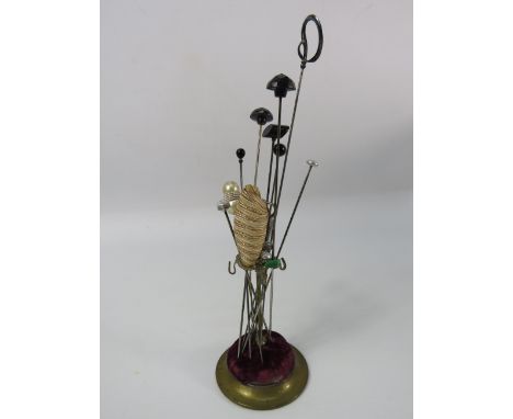 Vintage brass hat pin stand and a selection of pins including one by Charles Horner.