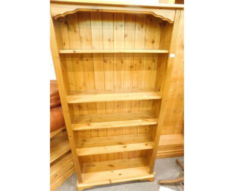 A pine open bookcase, with fixed shelves on bracket feet, 165cm high, 89cm wide.