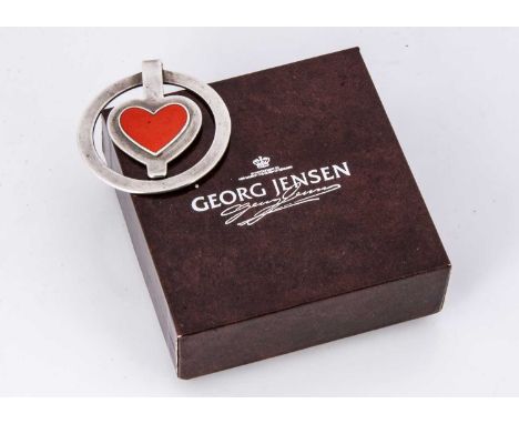A modern silver and enamel money clip Georg Jensen, circular for with red enamel heart, 4.9 cm marked to reverse and numbered