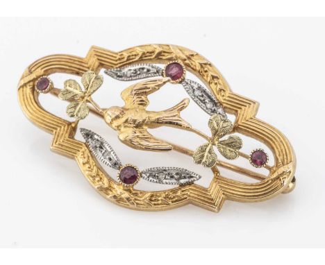 A French early 20th Century openwork oval brooch, centred with a swallow within clover leaf ruby and diamond set centre, 3.5c