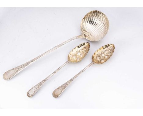 A George III silver soup ladle and a pair of Victorian silver berry spoons, 10 ozt, the ladle with bright cut handle and shel
