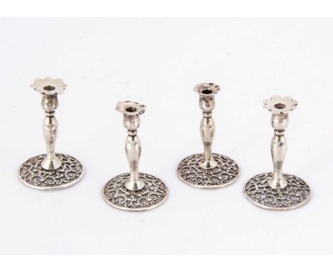 Two pairs of Victorian miniature dolls' house silver candlesticks by William Comyns, one pair 4cm high, the other 3.8cm (4)