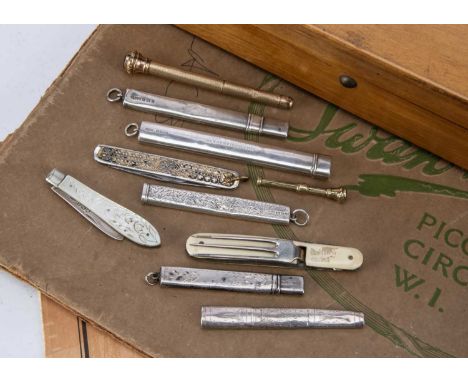 A small collection of silver and other pencil holders and related items, including a silver case with folding scissors, three