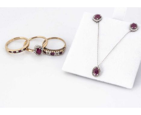 A contemporary set of 9ct gold ruby set jewellery, comprising a ring, pendant and matching earrings together with two ruby an