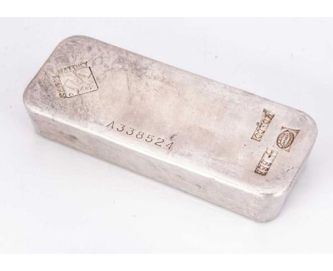 A Johnson Matthey 100 oz silver ingot, the solid bar weighing 3.11 kg, marked 999 and with serial number A338524, measuring 1