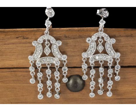 A pair of cz and silver chandelier drop earrings, with post backs marked 925 4 cm drop by 1.8cm