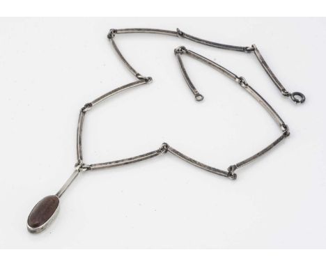 A Danish silver and amber pendant and chain, by N. E.From, the oval cabochon amber pendant on a fixed bar with curved chain l