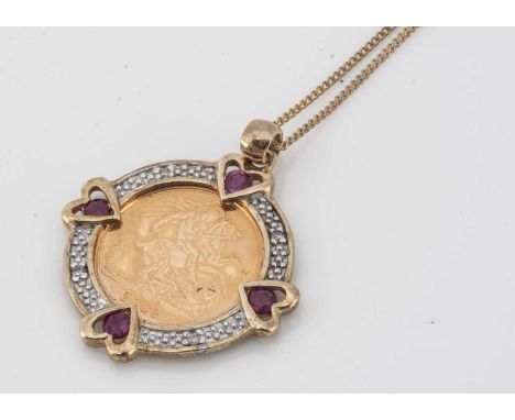 A contemporary Elizabeth II half sovereign pendant, dated 2008, within a 9ct gold ruby and diamond mount on a fine gold chain