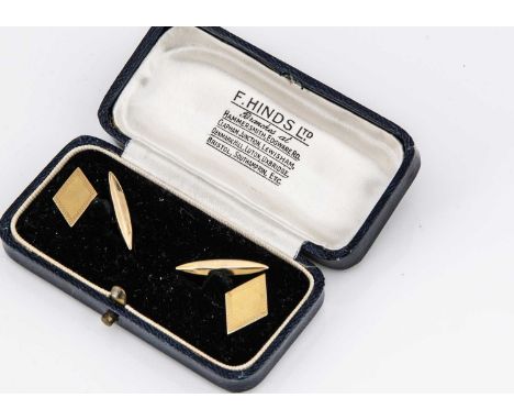 A pair of Art Deco 9ct gold cufflinks, the lozenge shape fronts with engine turned edges, on chain links and torpedeo backs, 