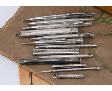 A group of eleven silver and silver plated pencils and related items, including one small retractable pencil and toothpick, a