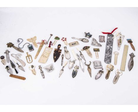A collection of bookmarks and other small items, including several silver bookmarks and many others, also a silver turtle bro