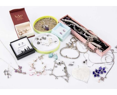 A collection of silver and other costume jewels, including bracelets, necklaces, earrings and other items