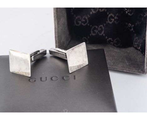 A Pair of Gucci silver cufflinks, the square fronts with chamfered edges, post hinged backs, 16.3 cm square, in a leatherette