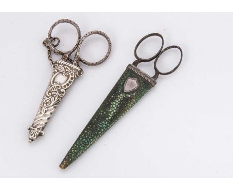 Two 19th century cased pairs of scissors, one a Victorian silver sheaf with chain and asscoiated scissors, 9cm high, the othe