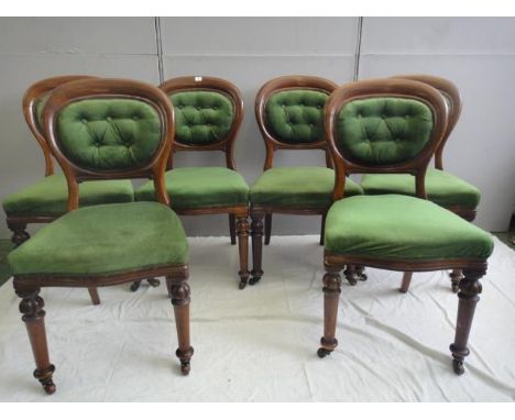 Set 6 Victorian Mahogany Balloon Back Dining Chairs on carved & turned front supports with ceramic castors, filled in back pa