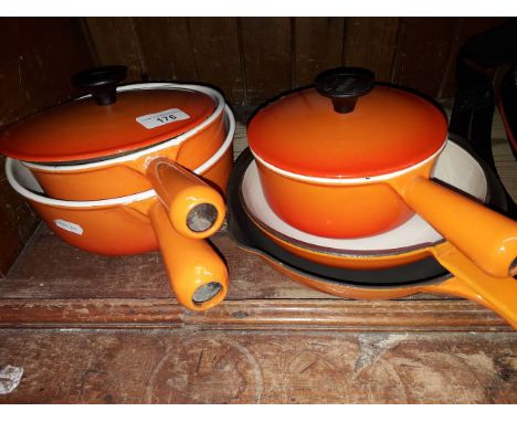 Four French Cousances 22 pans and another unmarked. Condition - all stamped apart from one, one with chip to enamel on lid, m