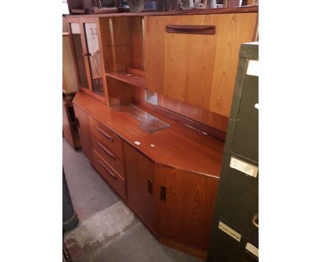 A G-Plan teak sideboard.Condition: various stains and ring marks to inner of drinks cabinet section, magnetic fastners missin