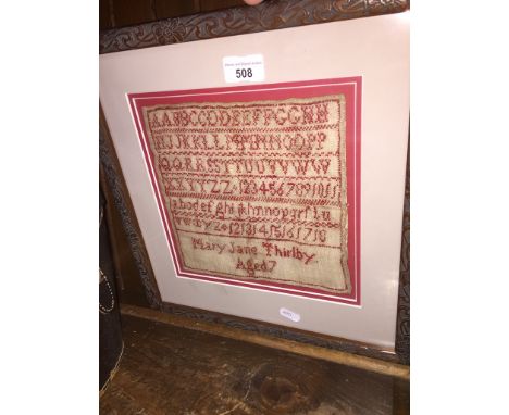 A framed sampler by Mary Jane Thirlby aged 7 