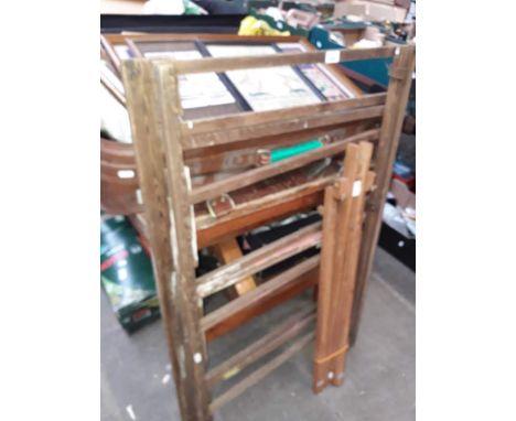 A wooden clothes airer and an easel. 