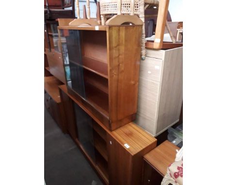 Ten items of furniture comprising two bookcases, a teak lounge sideboard, a chest of drawers, a dressing table, a tile top co