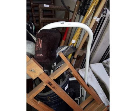A mixed lot comprising golf clubs, step ladders, garden tools and an easel. 