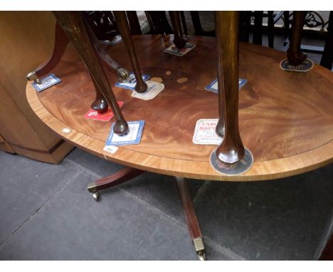 A good quality reproduction marquetry inlaid oval coffee table and another tripod table. 