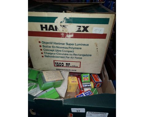 A Hanimax projector and a box of photographic accessories including films, filters etc.