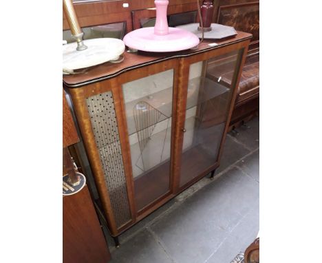 A retro glazed display cabinet.Condition: all glass panels and shelves free from damage, top surface with ring marks and stai