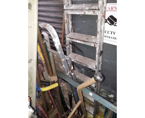 Bundles of garden tools, two pairs of aluminium step ladders and a sack truck. 