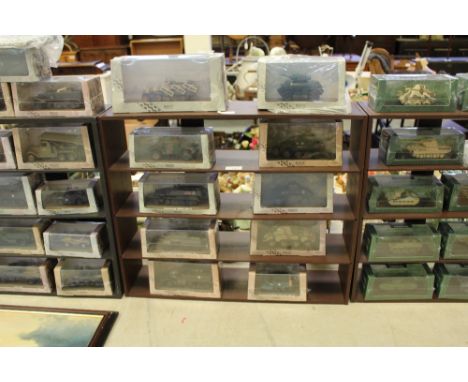 Box of model military vehicles and stand