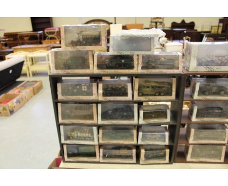 Box of model military vehicles and stands