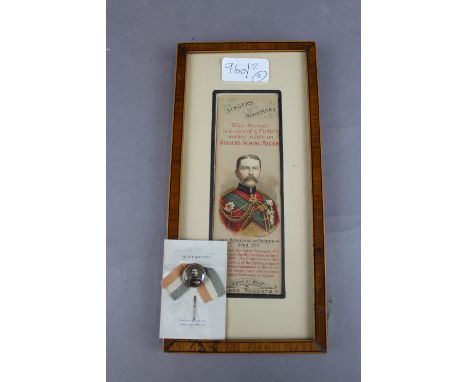 A Framed Singers bookmark to Lord Kitchener of Khartoum and a carded stick pin of Kitchener