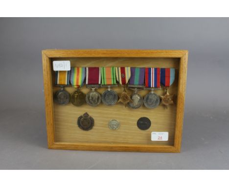 An Interesting Framed Group of 8 WW1 and WW2 Campaign medals awarded to Henry William Hutton including WW1 War and victory me