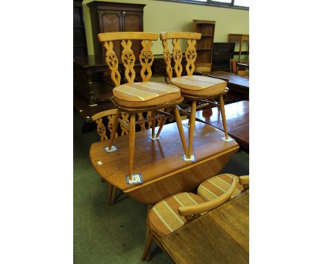 Ercol dining table and six chairs