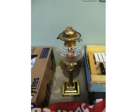 A Victorian brass table oil lamp, of Corinthian design, with cut glass reservoir, 51cm high, with orange tinted etched and cr