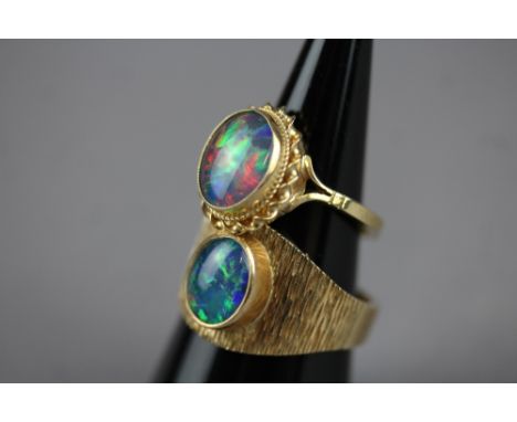 Two large opal 9ct rings (13gms)