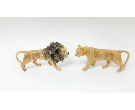 Three Beswick models - Lion no. 1506, Lioness no. 1507 and Lion Cub no. 1508, all designed by Colin Melbourne, together with 