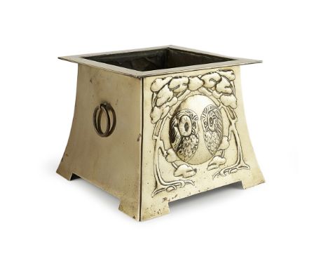 GLASGOW STYLE  BRASS JARDINIÈRE, CIRCA 1900   repoussé-decorated with opposed roundels of owls within foliate band, ring carr