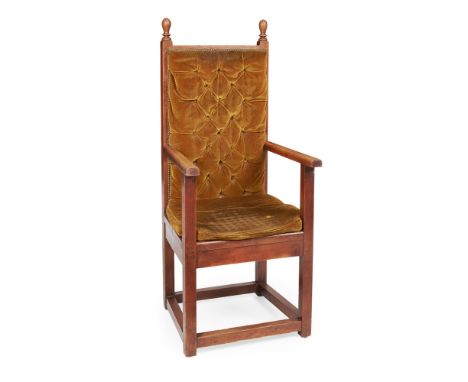ATTRIBUTED TO MACKAY HUGH BAILLIE SCOTT  ARTS & CRAFTS OAK FRAMED ARMCHAIR, CIRCA 1900   with button upholstered back above o