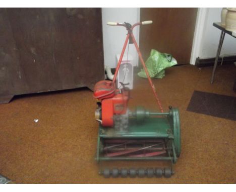 Petrol lawnmower with roller