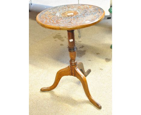 A circular occasional table with walnut tripod base and later carved oak top, diameter 45cm.