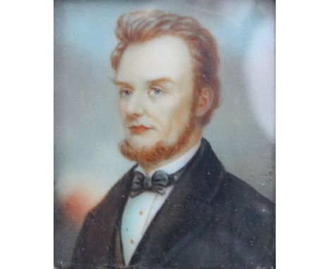 A late 19th/early 20th century rectangular portrait miniature of a bearded gentleman wearing black jacket and black bow tie, 